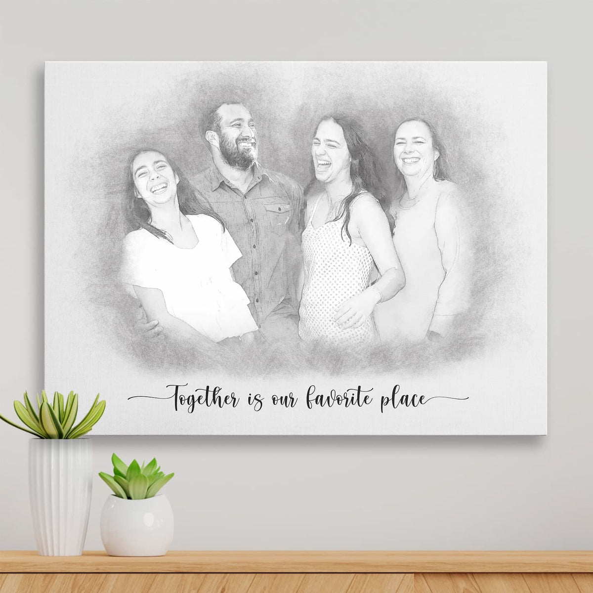 Sketch-style portrait of four adults laughing together, printed on canvas, with a script caption beneath