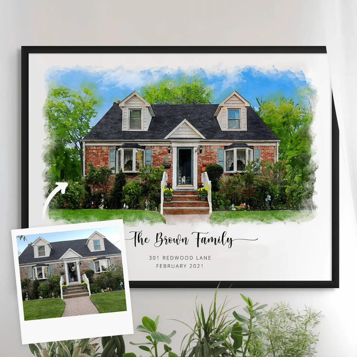 Watercolor-style portrait of a brick house with a dark roof, 'The Brown Family', in a black frame, with its reference photo