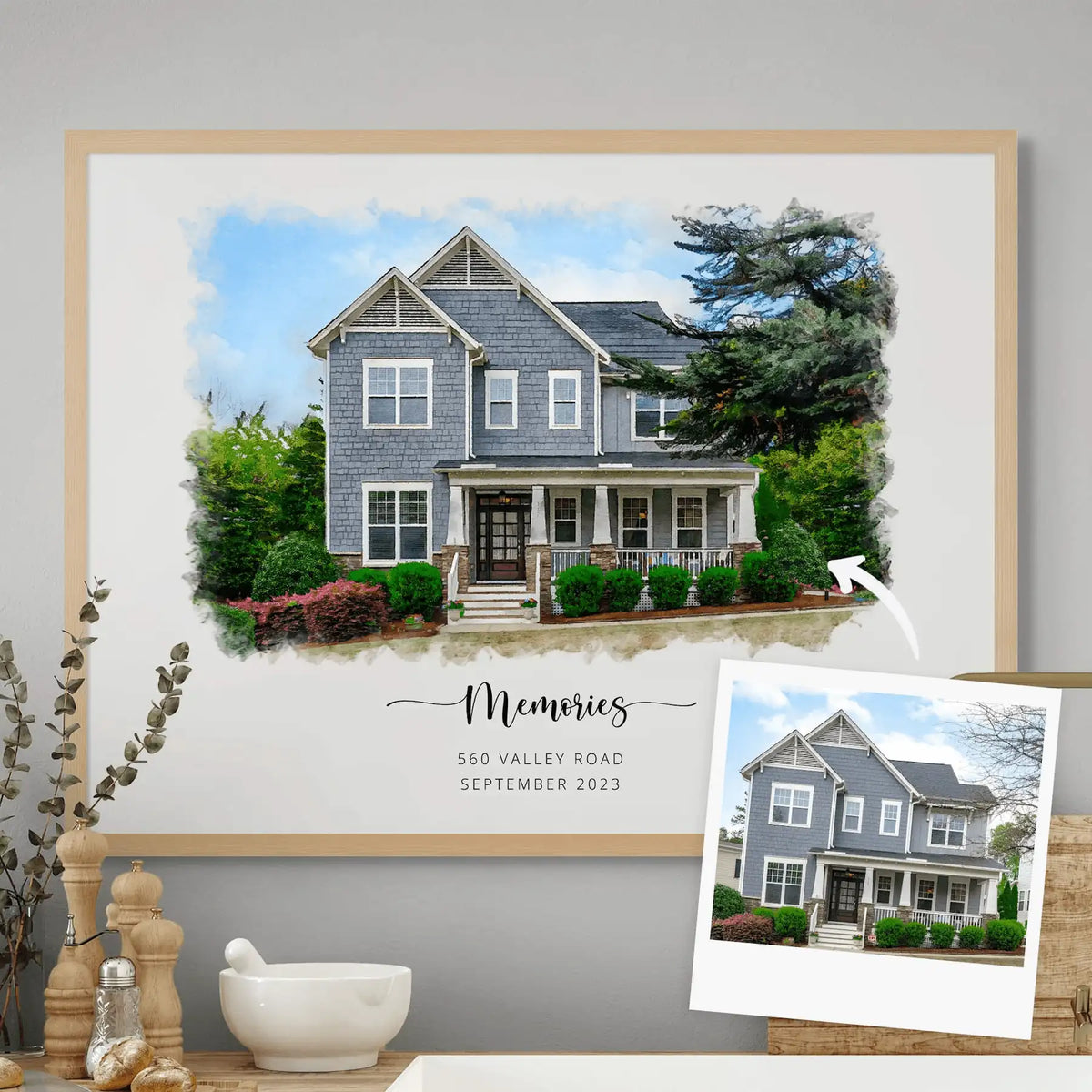 Watercolor-style portrait of a blue-shingled house with a porch, 'Memories', in a light oak frame, with its reference photo