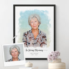 Watercolor-style memorial portrait of a silver-haired woman, 'In Loving Memory' printed below, framed in matte black