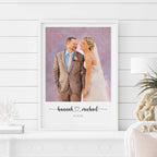 Oil-style portrait of a smiling couple, in a white frame on a white shelf, their names and a date below